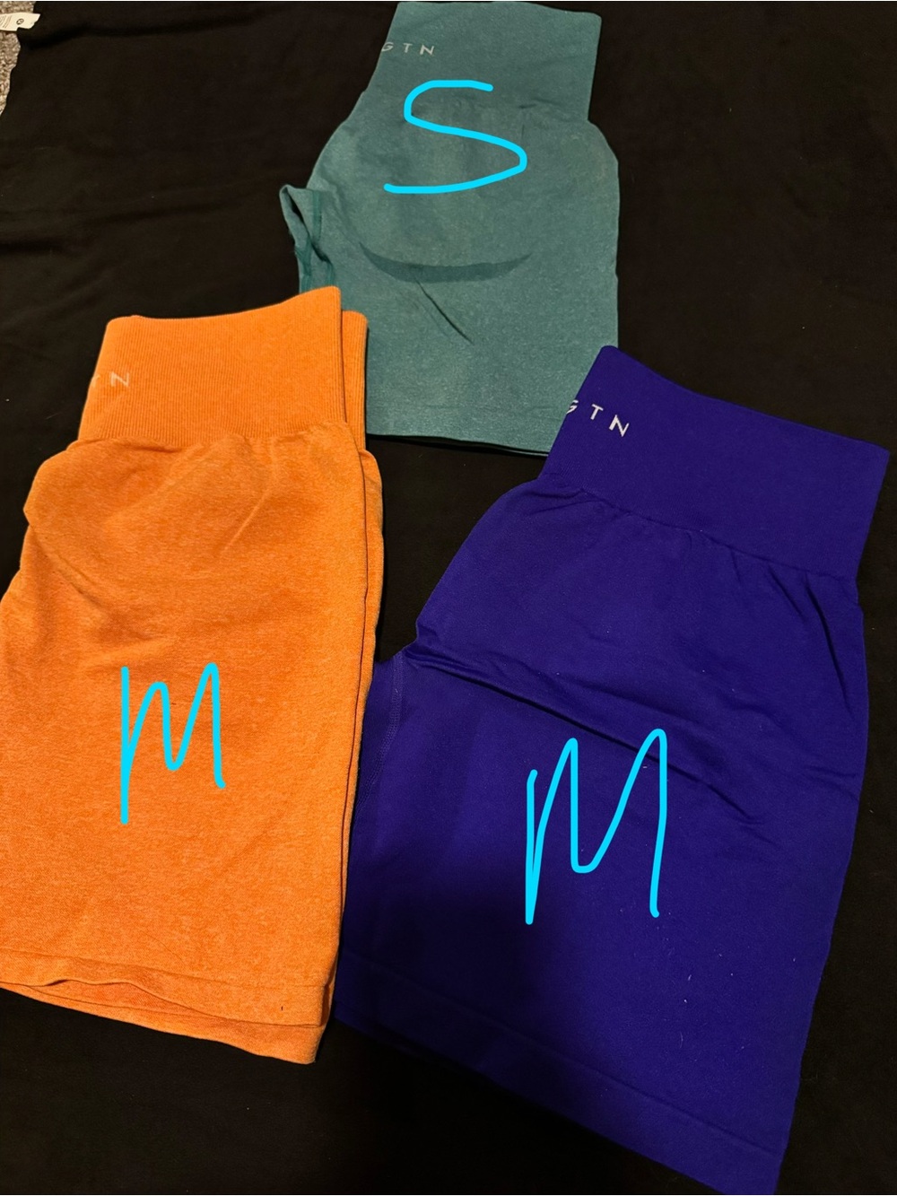 NVGTN High-Waist Seamless Leggings Set in Orange, Teal, and Royal Blue